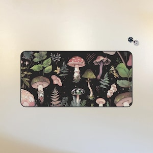 May include: A black background with a variety of mushrooms in different colors and shapes. The mushrooms are surrounded by green leaves and vines.