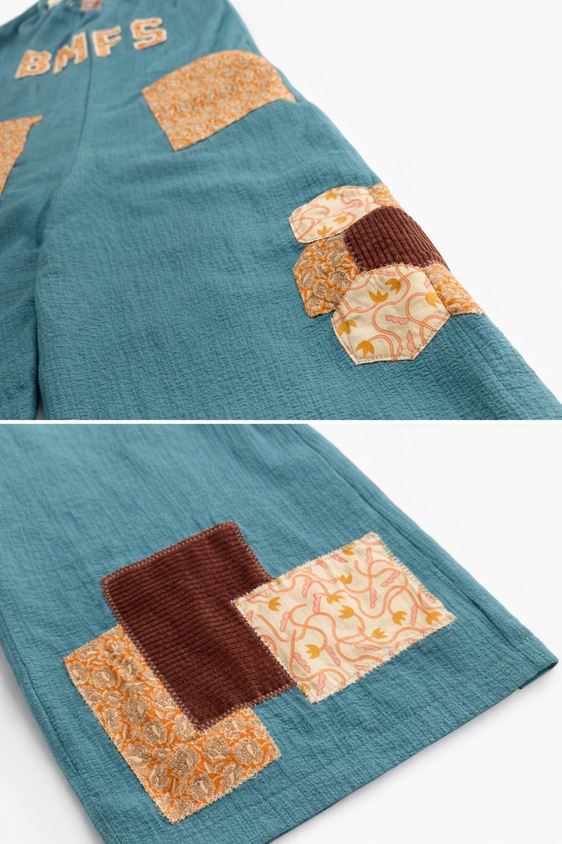 Puede incluir: Pantalones de color turquesa con parches decorativos en tonos marr&oacute;n y naranja. Los parches presentan varios patrones y texturas, incluyendo pana y dise&ntilde;os florales. Las letras "BMFS" est&aacute;n bordadas en la cintura.