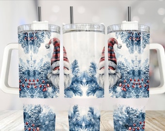 May include: A white stainless steel tumbler with a handle and a clear lid. The tumbler features a watercolor design of a gnome with a red hat and blue pine branches with red berries.