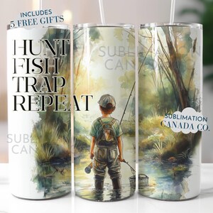 May include: A white tumbler with a green, blue, and brown watercolor design of a young boy fishing in a stream. The text "Hunt Fish Trap Repeat" is printed on the left side of the tumbler. The text "Sublimation Canada Co." is printed on the right side of the tumbler.