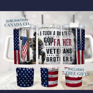 May include: A stainless steel tumbler with a white handle and a lid. The tumbler has a design of an American flag with a soldier standing in front of a cross. The text on the tumbler reads "I took a different test. God is my Father. Veterans are brothers."