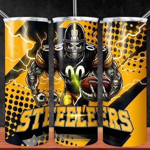 May include: A yellow and black tumbler with a skull-faced football player wearing a Steelers jersey and holding a football. The tumbler has a black and yellow polka dot pattern and the word "Steelers" in black letters.