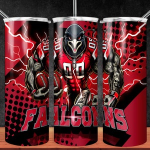 May include: A red and black tumbler with a cartoon image of a football player wearing a red jersey with the word "FALCONS" on it. The player is holding a football and has a lightning bolt design in the background.