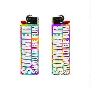 May include: Two lighters with the text "SUMMER SHOULD BE FUN" in white, set against a colorful background of yellow, orange, pink, and blue. The lighters have a red ignition button and a black metal top.