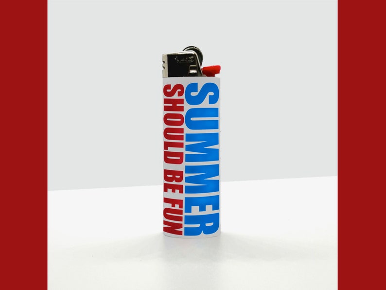May include: A white lighter with the words "SUMMER SHOULD BE FUN" printed vertically in blue and red. The lighter has a red ignition button and a metal top.