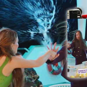 May include: A scene from a television show with a woman in a green top reaching out towards a burst of water. Another woman in a dark purple suit is in the background. The text "COMMENTS BY BRAVO" is visible.