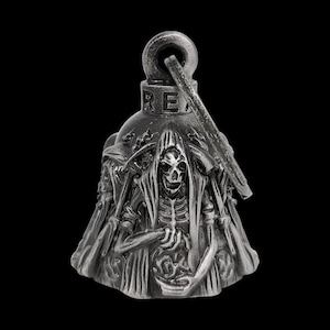 May include: A silver-colored bell with a grim reaper design. The bell features a detailed depiction of the grim reaper holding a scythe, with the word "RE" on the top. The bell is designed to be hung.