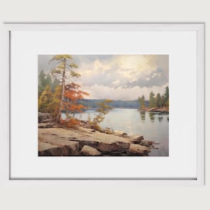 May include: A painting of a lake scene with a rocky shoreline and trees in the background. The water is calm and reflects the sky, which is a mix of blue and gray with some white clouds. The trees are mostly green, but some have red and orange leaves, suggesting autumn.