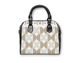 Elegante borsa a tracolla in ecopelle, con vivace stampa geometrica, tracolla regolabile e tasca con cerniera.