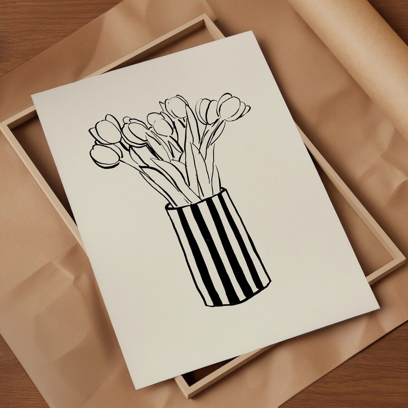 May include: A black and white line drawing of a bouquet of tulips in a striped vase. The vase is black and white with vertical stripes.