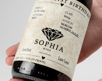 May include: A wine bottle with a label that says "Happy 21st Birthday" and features a diamond graphic. The label also includes the name "Sophia" and the text "Wine Exclusive".