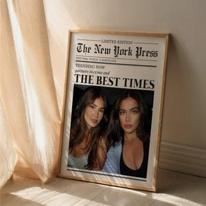 May include: A mock newspaper print with the headline "The New York Press" and the subheading "TRENDING NOW: partners in crime and THE BEST TIMES". Two women are pictured in the newspaper.