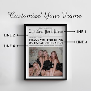 May include: A framed print of a newspaper article with the headline "The New York Press" and the text "Thank you for being my unpaid therapist." The article features a photo of four women.