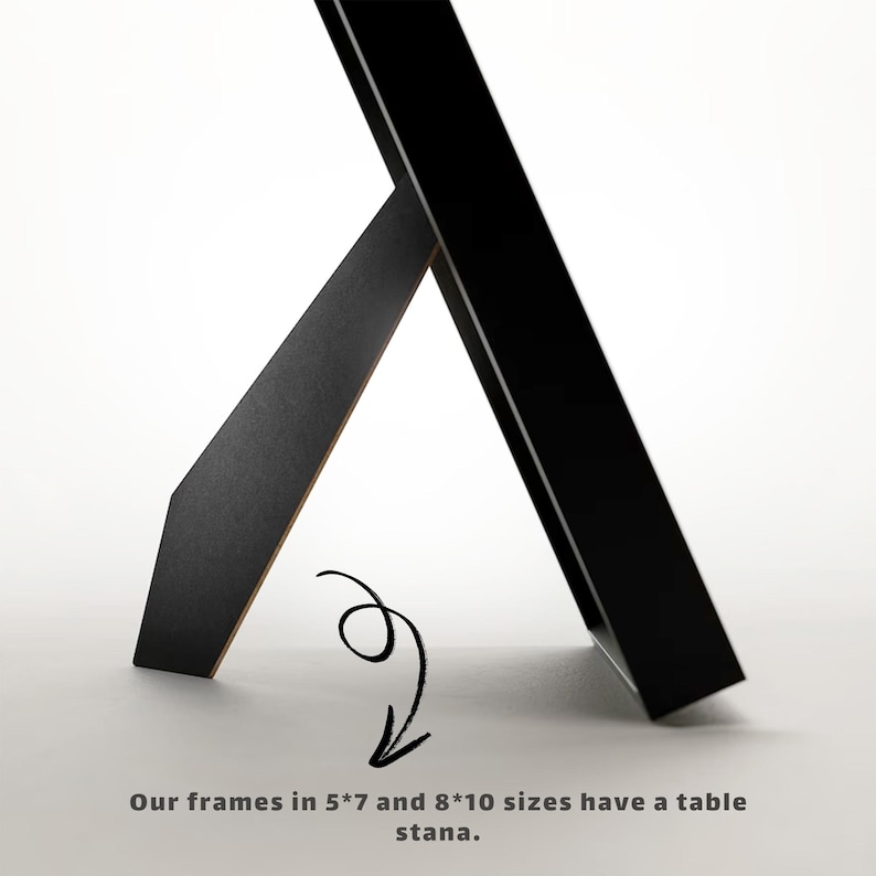May include: Black picture frame with a table stand. The frame is 5x7 inches or 8x10 inches.