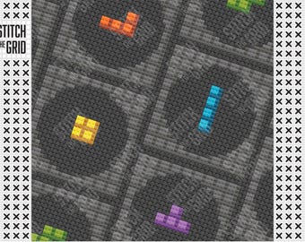 May include: A cross-stitch pattern featuring colorful Tetris-like shapes in orange, yellow, blue, and purple on a gray background. The words "STITCH THE GRID" are printed vertically on the left side of the image.