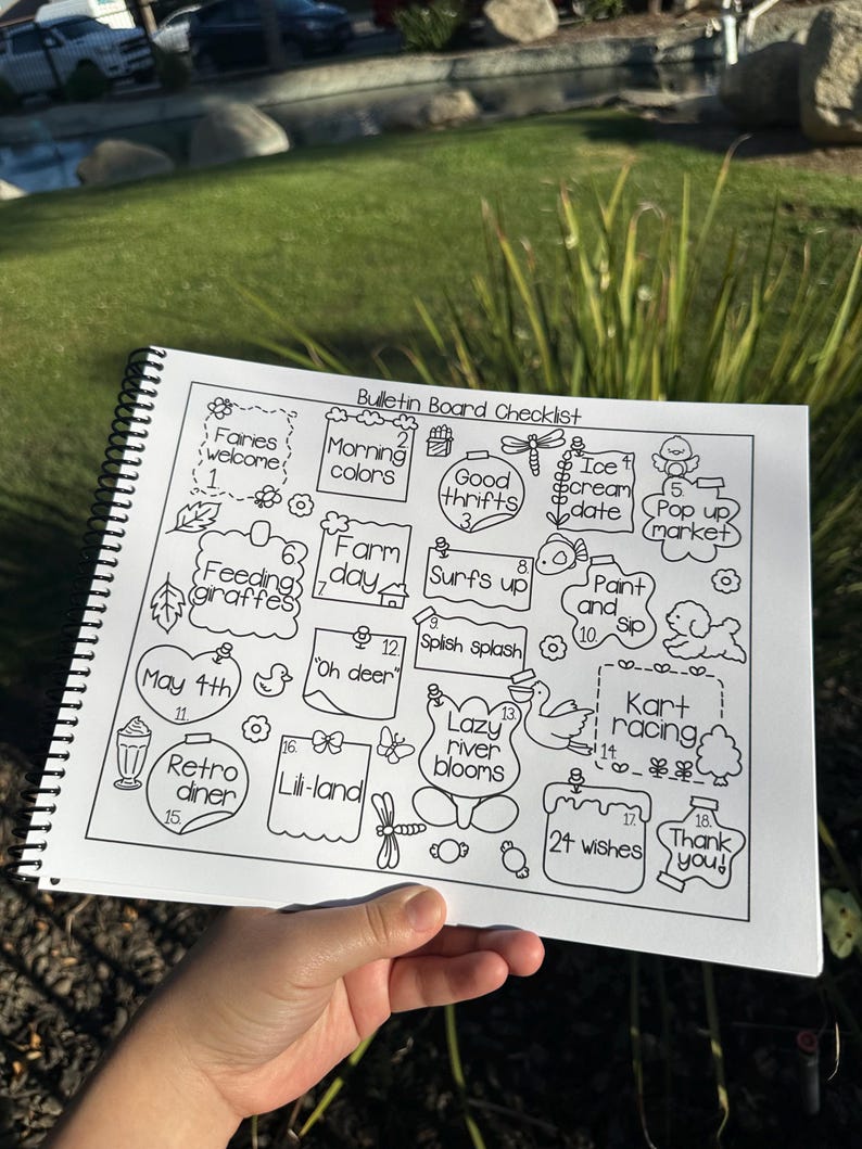 May include: A black and white spiral-bound notebook with a "Bulletin Board Checklist" title. The checklist includes hand-drawn illustrations and text such as "Faries welcome", "Morning colors", "Good thrifts", "Retro diner", and "24 wishes".
