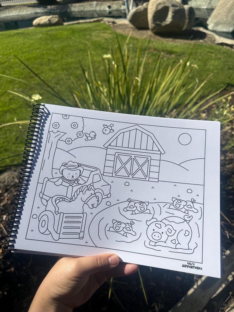 May include: A spiral-bound coloring book featuring a farm scene with a barn, tractor, and animals. The black and white illustrations include a bear driving a tractor, cows, and pigs. The text "Lili's Adventures" is visible.