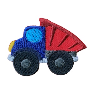 May include: A blue and red embroidered iron-on patch of a dump truck. The truck has a yellow headlight and black tires.