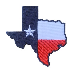 May include: A blue, white, and red embroidered patch shaped like the state of Texas with a white star in the blue section.