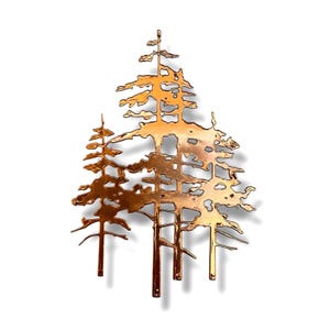 May include: A copper metal wall art sculpture of three stylized trees. The trees are cut out of metal and have a rustic, weathered look.