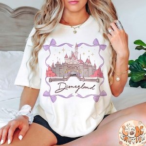 Retro Cute Disneyland Castle Coquette Bow Comfort Colors Shirt, Disney Girl Trip Shirt, Disney Women&#39;s Shirt, Disney Vacation 2025 Tee