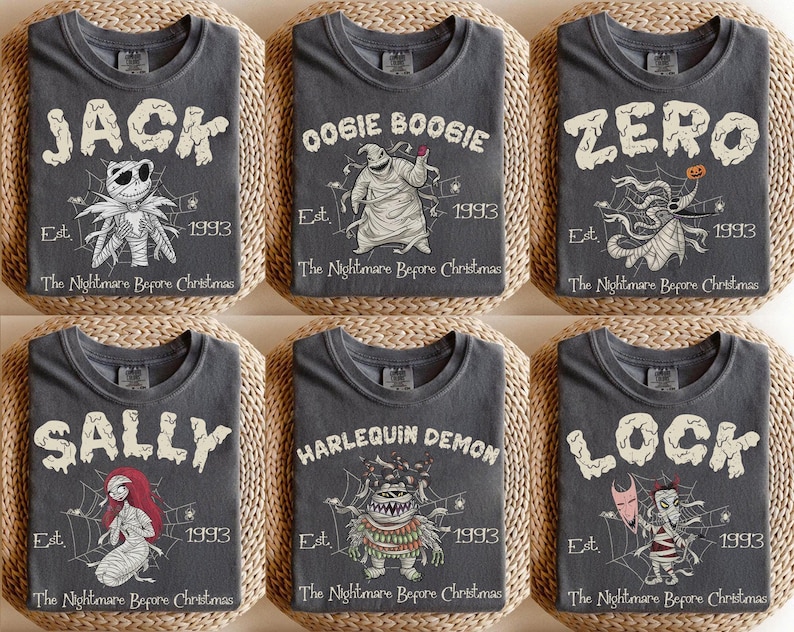 May include: Six charcoal grey t-shirts featuring characters from The Nightmare Before Christmas. Each shirt displays a character name, a graphic of the character, the text Est. 1993, and the title The Nightmare Before Christmas in white.