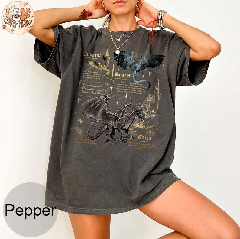 May include: A dark gray oversized t-shirt with a graphic print of three dragons and the text "Andarna", "Sgaevl", and "Taten".