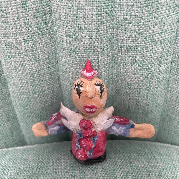 Bald,legless +tiny hat glued Melanie Martinez figure, (doesn’t come with mushroom tank)