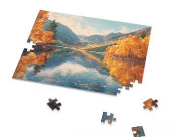 May include: A partially assembled jigsaw puzzle depicting a scenic landscape with a lake reflecting the sky and surrounding mountains. The puzzle features autumn trees with orange and yellow foliage. Several puzzle pieces are scattered around the partially completed puzzle.