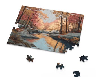 May include: A partially assembled jigsaw puzzle featuring a scenic autumn landscape. The image depicts a river flowing through a forest with trees displaying vibrant red, orange, and yellow foliage. Several puzzle pieces are scattered around the partially completed puzzle.