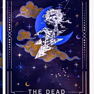 May include: A tarot card featuring a skeleton figure with a tree-like head, set against a dark blue night sky with stars, clouds, and a crescent moon. The card is framed with a gold border and the text "THE DEAD" is at the bottom.