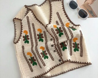 Cardigan sans manches fin tricoté à crochets, style rétro léger, gilet pour femme exquis à col en V, décoration de broderie végétale mignonne