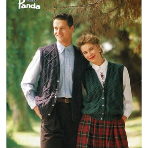 May include: A vintage fashion image featuring a man and woman wearing knitted vests. The man wears a dark blue vest over a light blue shirt and brown corduroy pants. The woman wears a green vest over a white shirt and a red plaid skirt. The Panda logo is in the top left.