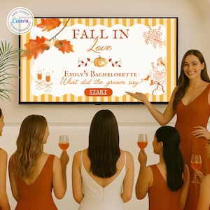 May include: A TV screen displays a bachelorette party game with the text "FALL IN Love" and "Emily's Bachelorette". The game features fall-themed graphics. Several women in rust-colored dresses are gathered, some holding glasses of wine.