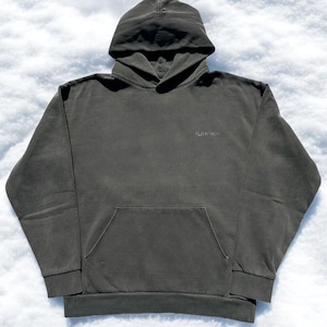 May include: A dark green hooded sweatshirt with a small "SUNNY RICH" logo on the front. The sweatshirt has a kangaroo pocket and long sleeves.