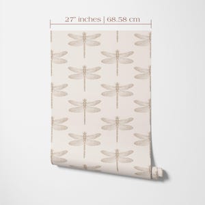 27 inches wide wallpaper roll with a dragonfly print in beige and brown.