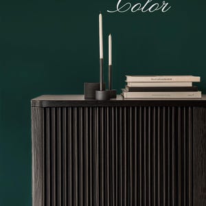 Black console on a bold dark green solid wallpaper background