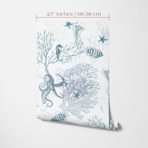 27 inches wide wallpaper roll with coastal seahorse, octopus, starfish and coral  print in blue color on a  white background.