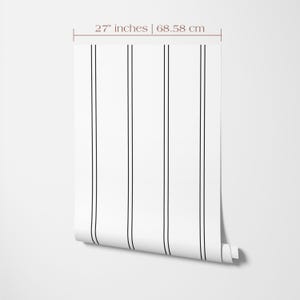 27 inches wide wallpaper roll with a black stripe print on a bright white background.