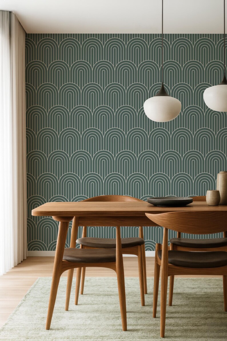 a modern dining room with a wooden table and chairs, a patterned wallpaper, and two pendant lights hanging above the table.