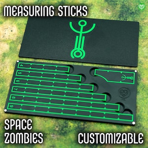 May include: Black measuring sticks with neon green markings and the text "MEASURING STICKS", "SPACE ZOMBIES", and "CUSTOMIZABLE". The sticks have a unique design with cutouts and a logo. The numbers 4 through 9 are visible on the measuring sticks.