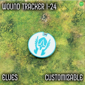 May include: A round, white and blue wound tracker with the text "WOUND TRACKER I-24". The tracker features a stylized emblem and the number 24. The words "ELVES" and "CUSTOMIZABLE" are also present.