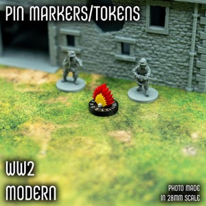May include: A tabletop game scene with miniature soldiers and a fire marker. The fire marker is black with red and yellow flames. The text "PIN MARKERS/TOKENS" and "WW2 MODERN" are visible. The photo is made in 28mm scale.