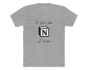 May include: A heather gray t-shirt with the text "I lost the N of time" in black. The letter "N" is inside a black cube. The shirt has short sleeves and a crew neck.