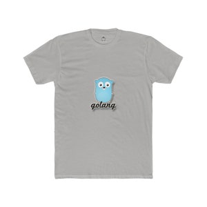 May include: A light gray t-shirt featuring a blue cartoon gopher with the word "golang" in black script below. The shirt has a crew neck and short sleeves. The design is centered on the front of the shirt.