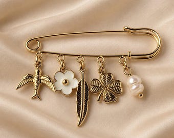 Gold-tone pin brooch with charms: bird, flower, feather and clover, boho chic costume jewelry, lucky charm accessory
