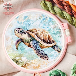 May include: A cross stitch pattern of a sea turtle swimming in blue water with white foam. The turtle is brown with a green shell and has a light blue background.