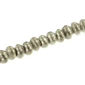 May include: A single strand of small, round, metallic silver-coloured beads arranged in a linear sequence. Each bead features a slightly irregular, textured surface with a reflective finish, strung together to form a continuous, uniform line.