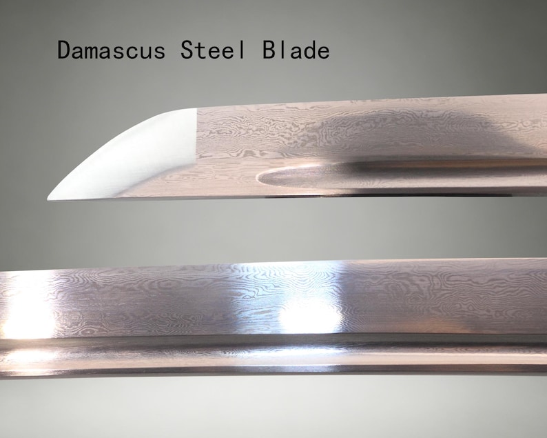 May include: A Damascus steel blade featuring a distinct wavy, layered metal pattern across the surface. The blade includes a prominent groove running along the length and a sharp, polished tip. The text Damascus Steel Blade is visible.