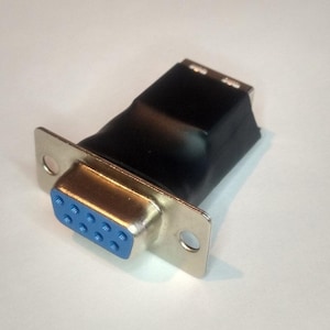 May include: A black and silver D-sub connector with a blue pin array. The connector has a rectangular shape with a metal casing and mounting holes. The image is a close-up shot of the connector.